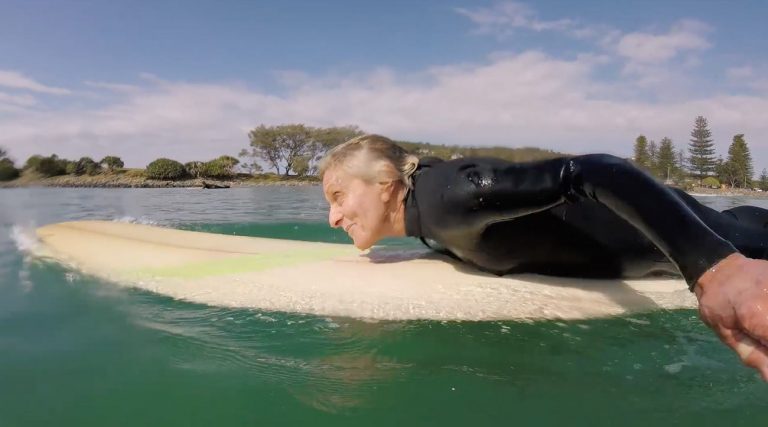 old woman surfing